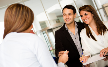 Loving couple checking in a hotel